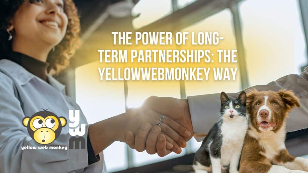 Woman with dark curly hair shaking a mans hand signifying the power of partnership. cat and dog in the corner with YellowWebMonkey logo.
