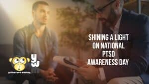 Two men in talk therapy, one is holding a clipboard and the other is clasping his hands