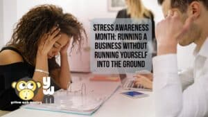 Small business owner sitting at desk looking stressed with open binder